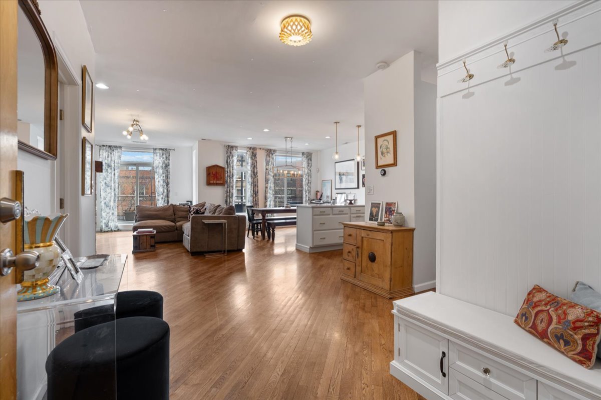 2121 West Division Street, Unit 1 Chicago, IL 60622 - Photo 3 of 18 a living room with furniture and a dining table with wooden floor