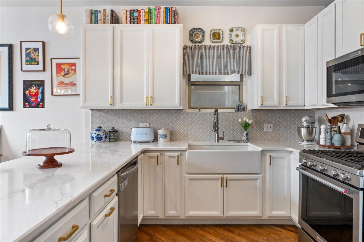 2121 West Division Street, Unit 1 Chicago, IL 60622 - Photo 8 of 18 a kitchen with cabinets appliances and a counter space