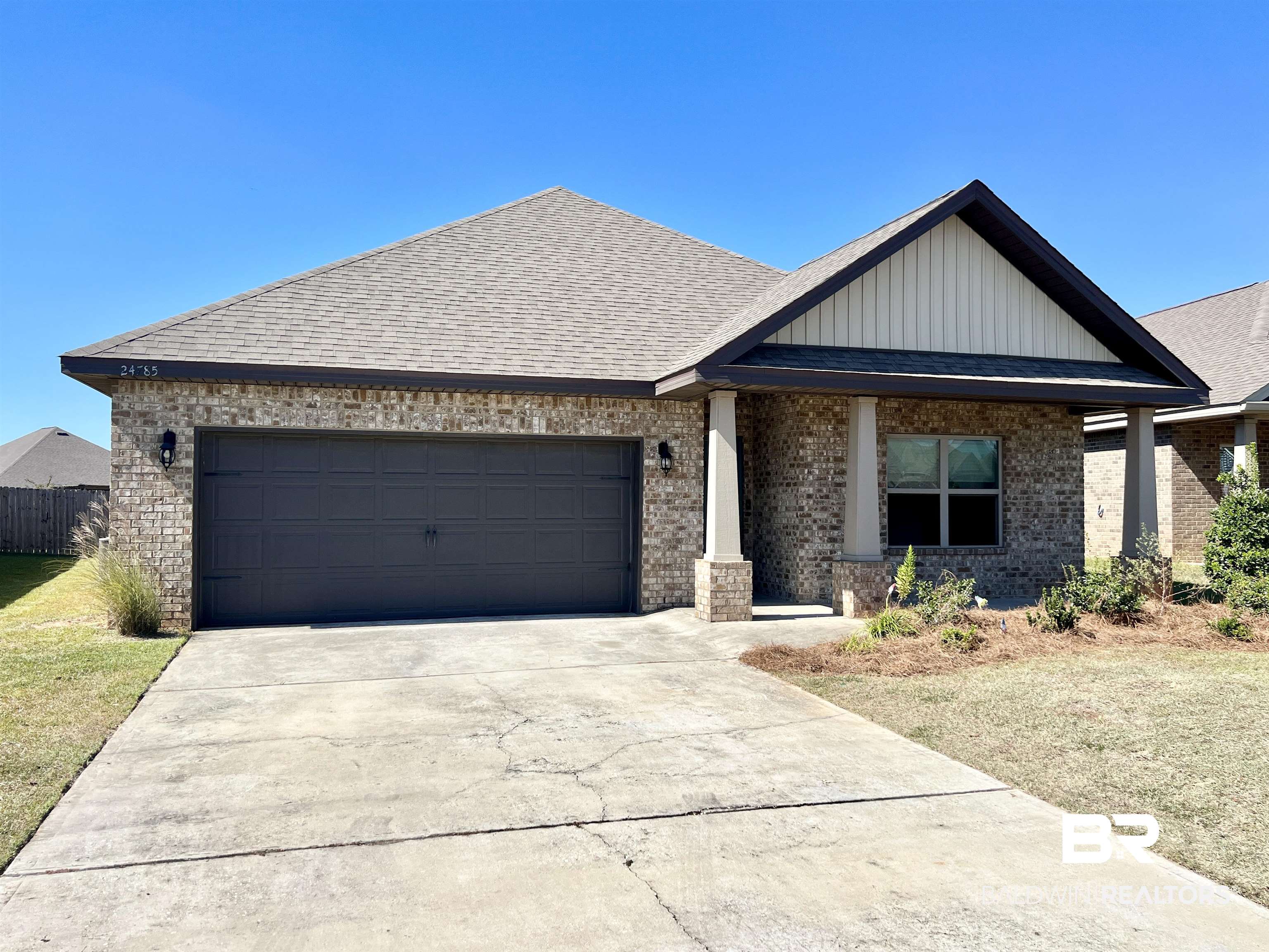 24785 Slater Mill Road Daphne, AL 36526 - Photo 1 of 46 View of front facade featuring covered porch and a garage