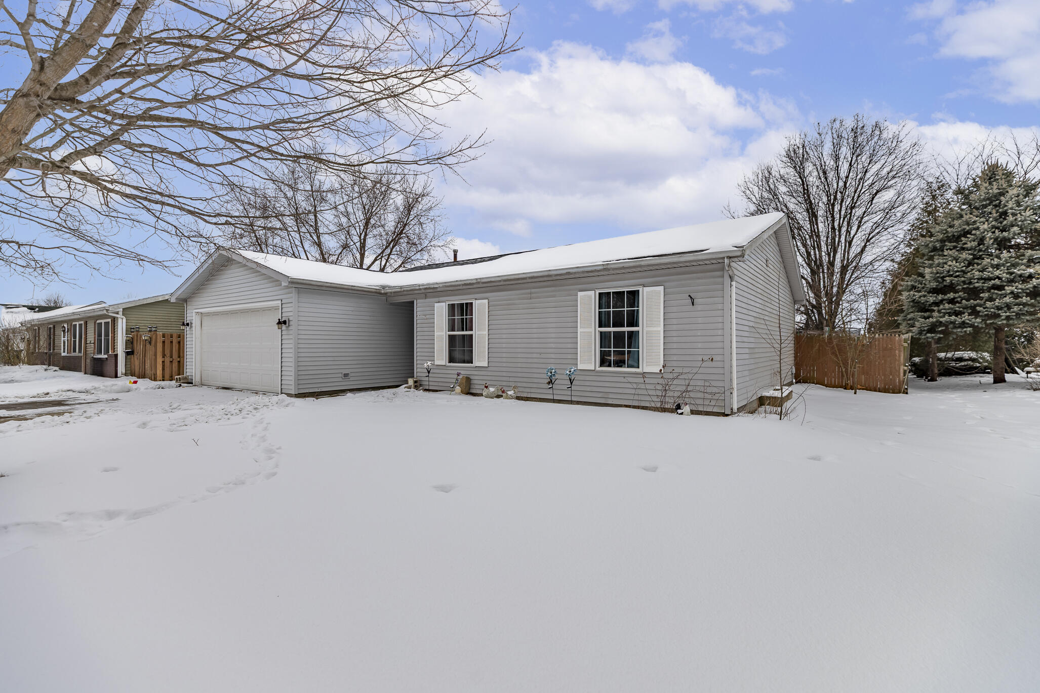 a view of a house with a snow in the yard