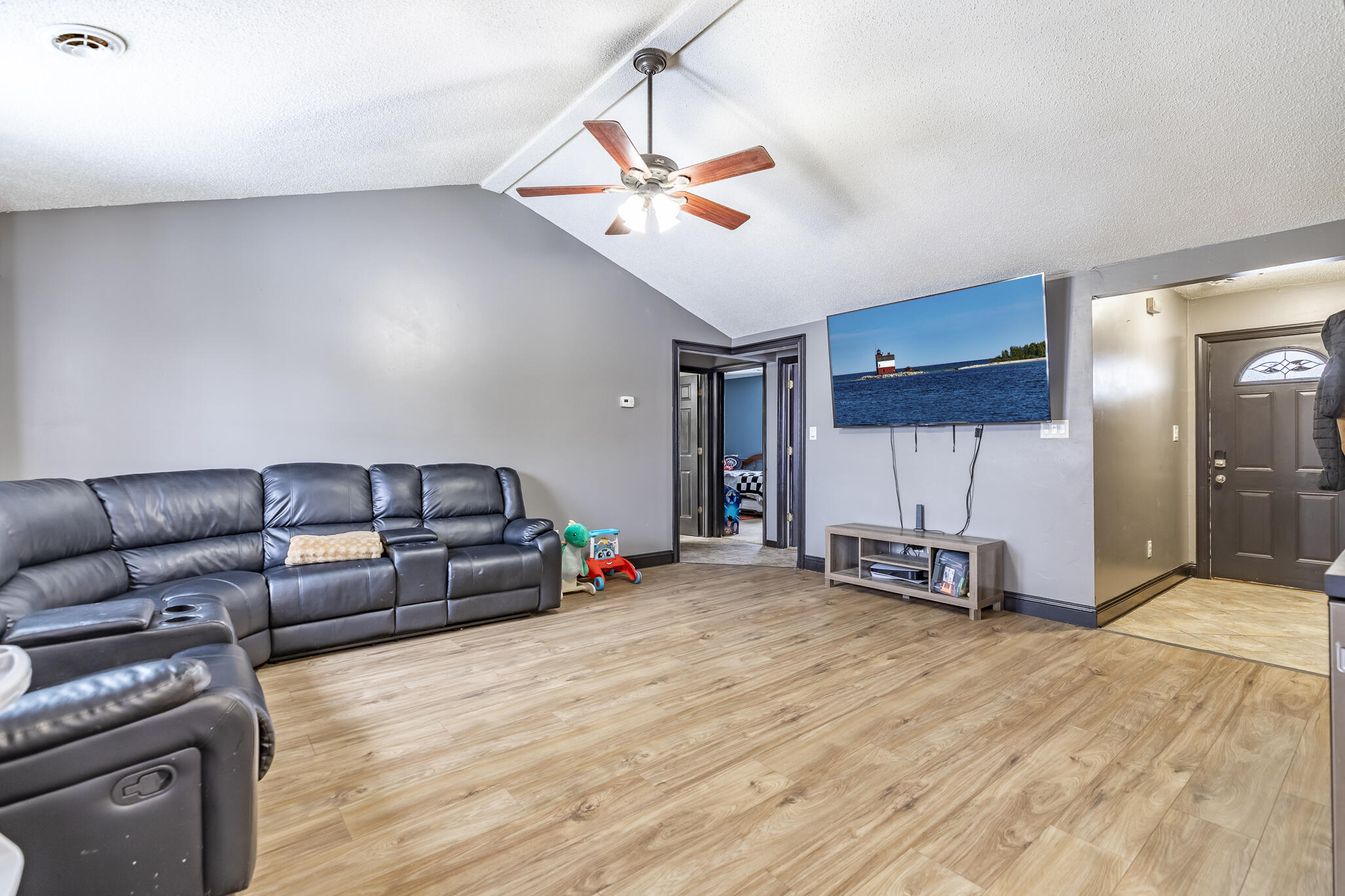 202 South Jefferson Street Hamlet, IN 46532 - Photo 11 of 20 a view of a livingroom with furniture and a ceiling fan