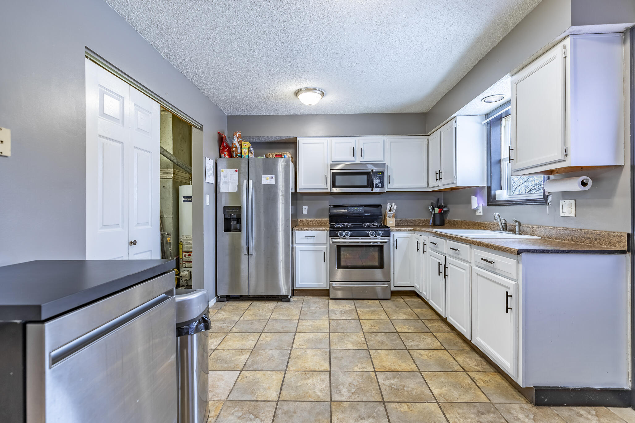 202 South Jefferson Street Hamlet, IN 46532 - Photo 13 of 20 a kitchen with stainless steel appliances a refrigerator sink and microwave