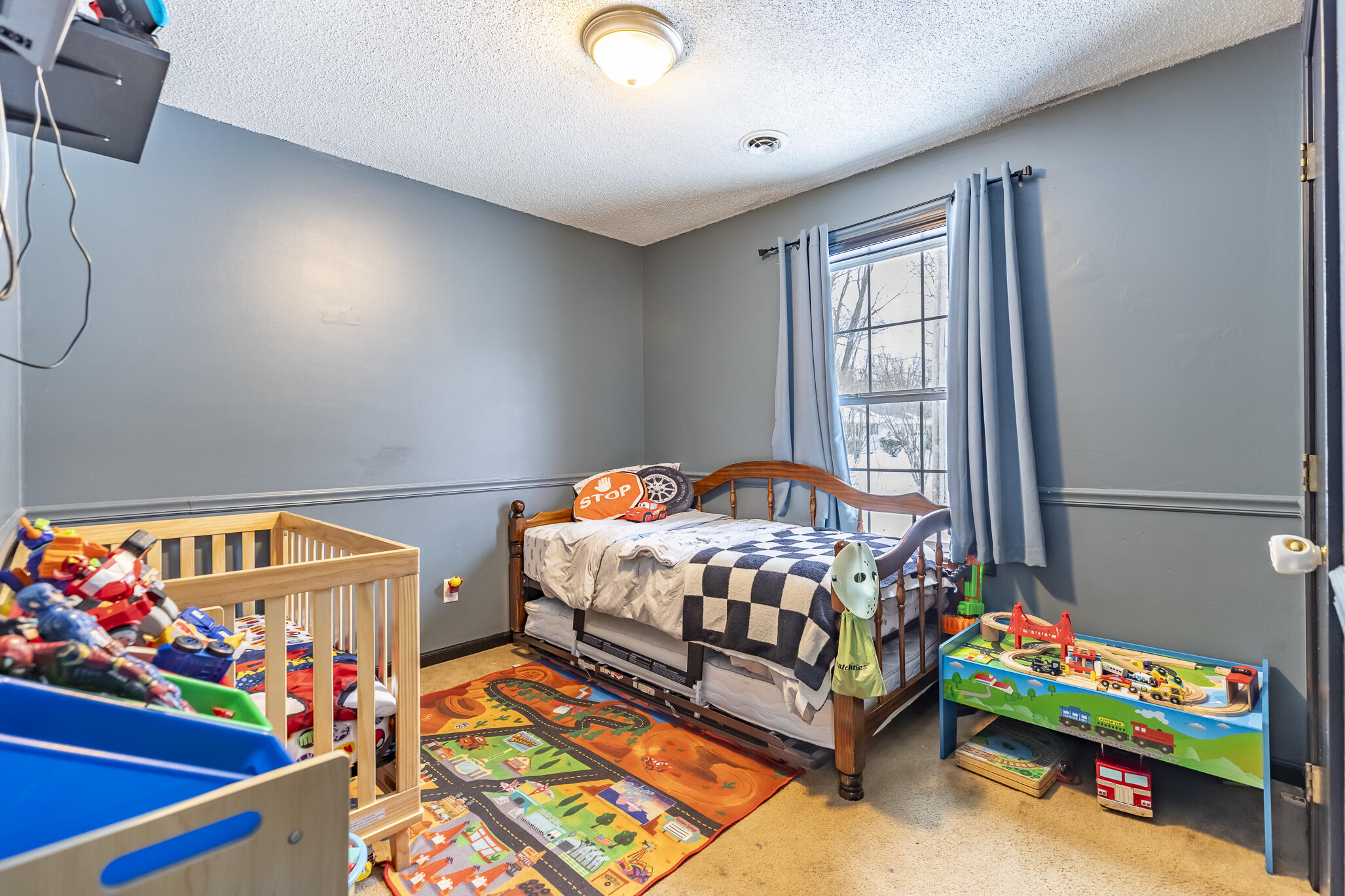 202 South Jefferson Street Hamlet, IN 46532 - Photo 16 of 20 a bedroom with furniture and a baby crib