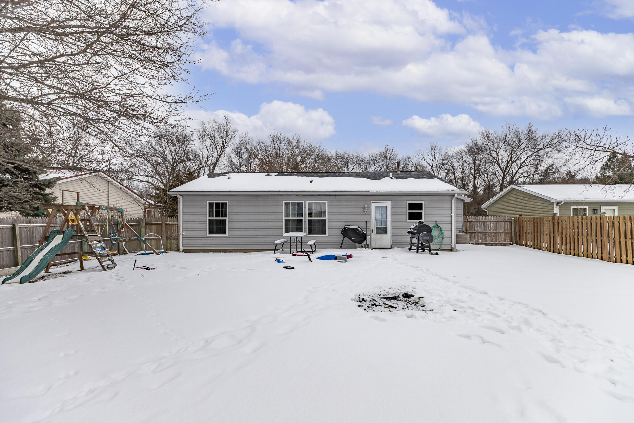 202 South Jefferson Street Hamlet, IN 46532 - Photo 2 of 20 a view of a house with snow in a yard