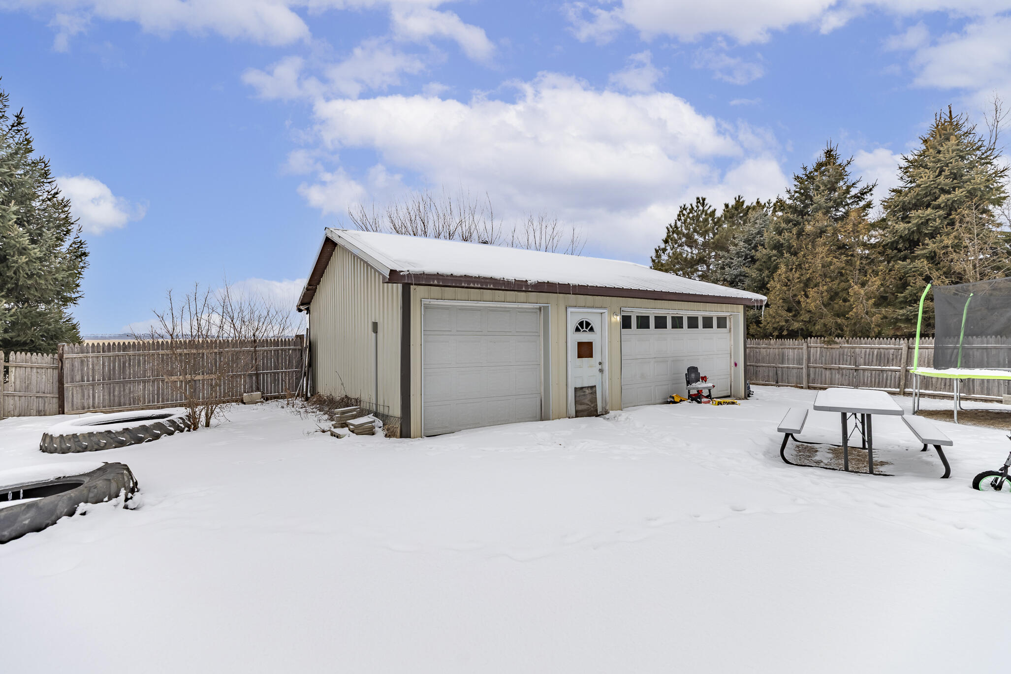 202 South Jefferson Street Hamlet, IN 46532 - Photo 4 of 20 a view of a house with backyard and sitting area
