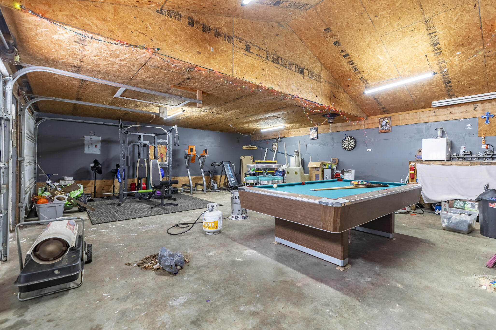 202 South Jefferson Street Hamlet, IN 46532 - Photo 7 of 20 a room with natural light fire pit and garage