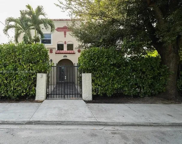 front view of a house with a bench