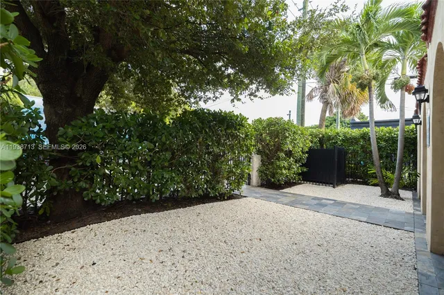 a view of a backyard of the house