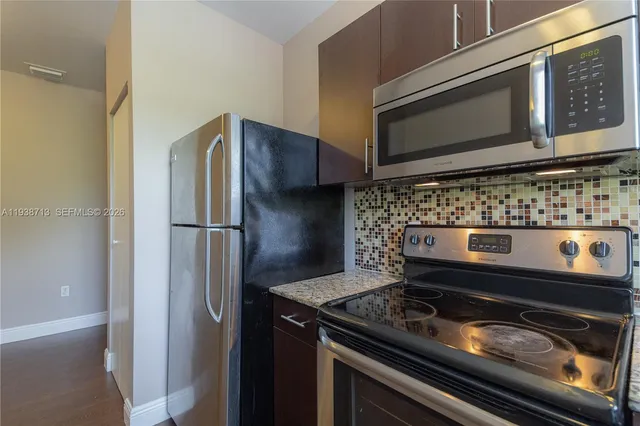 a kitchen with a stove microwave and refrigerator
