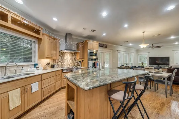 a kitchen with lots of counter top space and sink