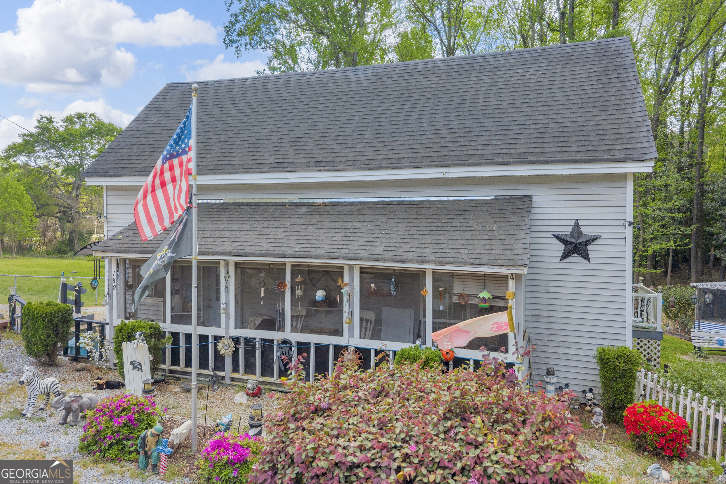 180 Liberty Circle Hartwell, GA 30643 - Photo 1 of 58 a front view of a house with a yard and fountain