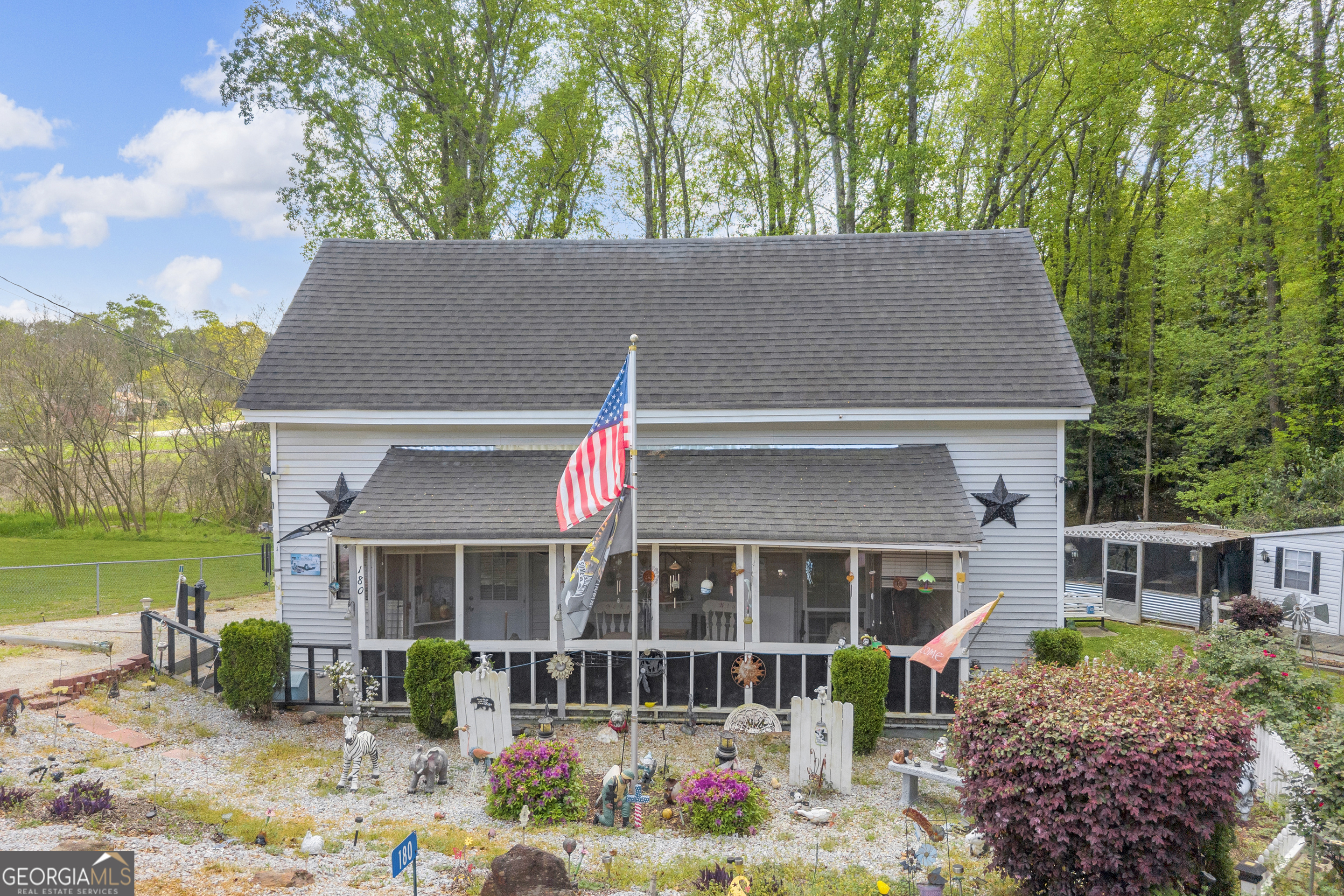 180 Liberty Circle Hartwell, GA 30643 - Photo 16 of 58 a front view of a house with garden