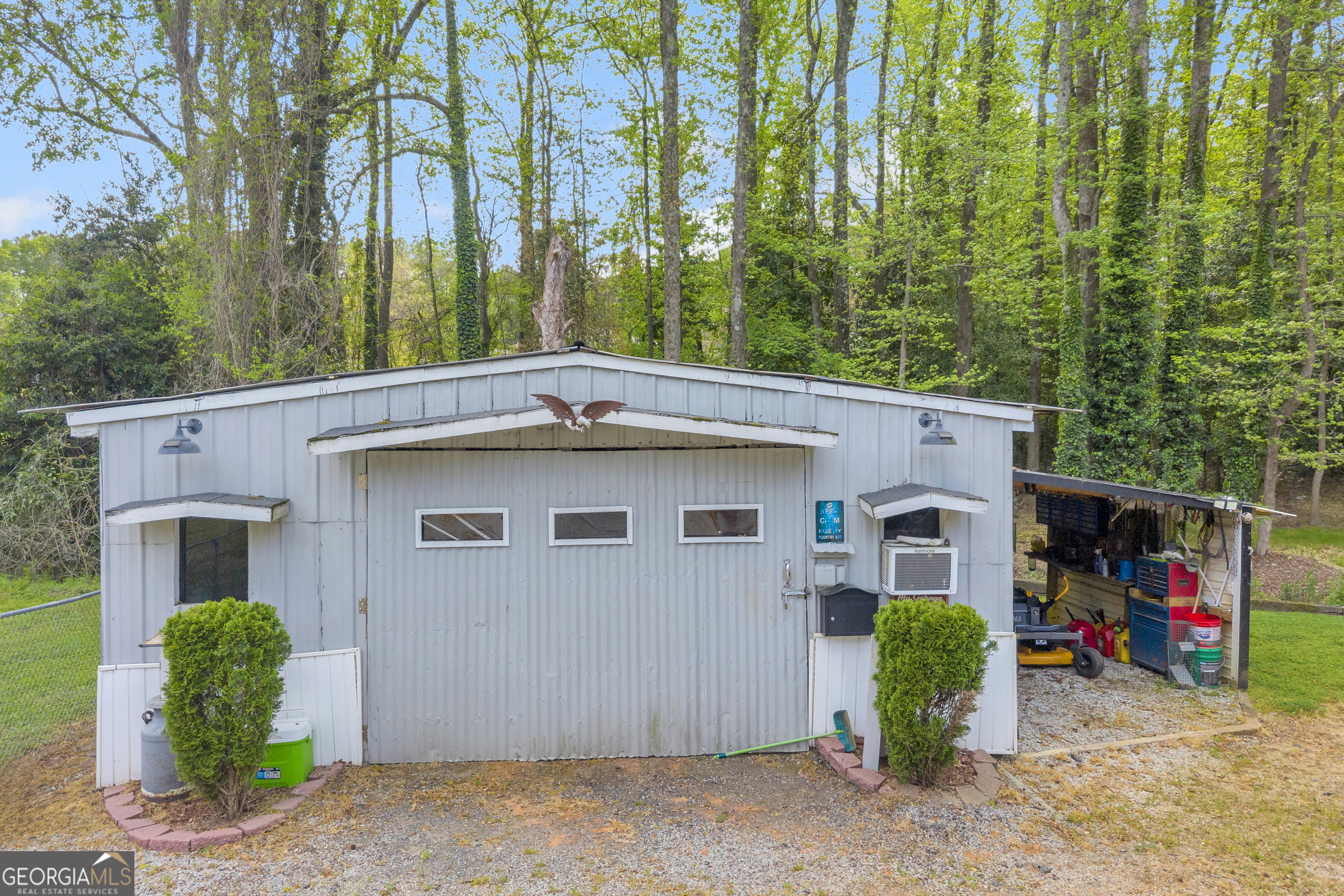 180 Liberty Circle Hartwell, GA 30643 - Photo 22 of 58 a view of a house with a patio and a yard