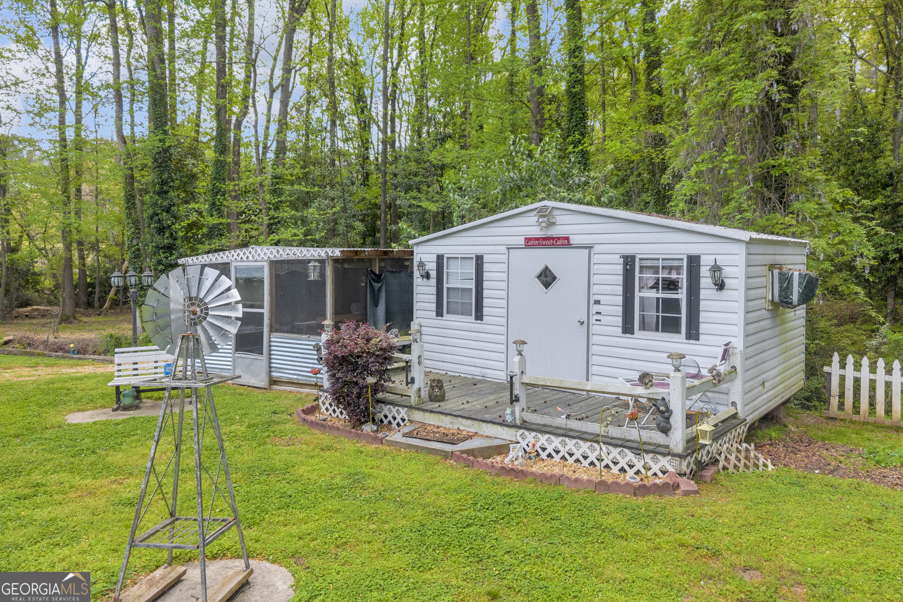 180 Liberty Circle Hartwell, GA 30643 - Photo 28 of 58 a view of a house with backyard and a tree