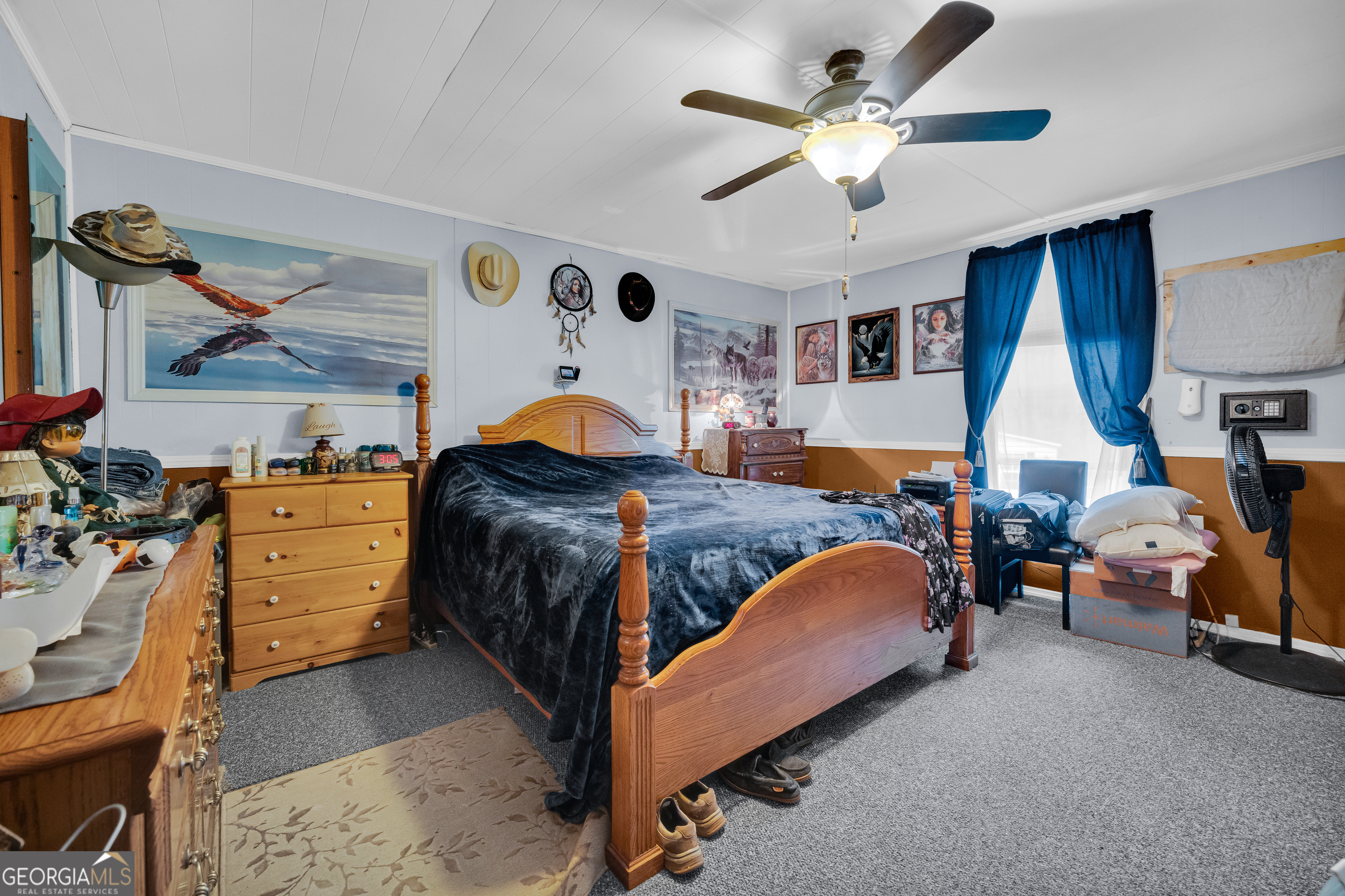 180 Liberty Circle Hartwell, GA 30643 - Photo 36 of 58 a bed room with a bed and a ceiling fan