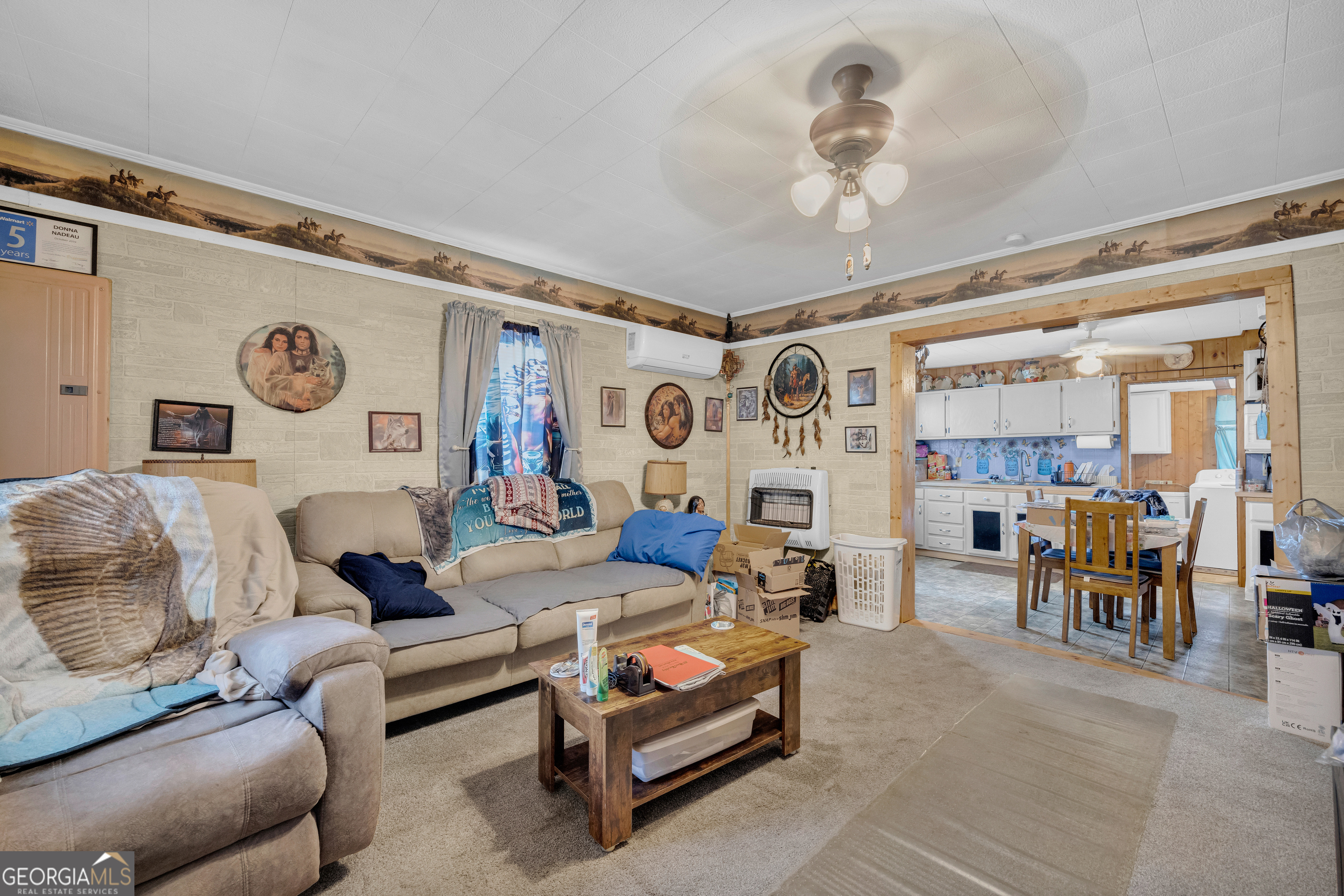 180 Liberty Circle Hartwell, GA 30643 - Photo 39 of 58 a living room with furniture and a chandelier