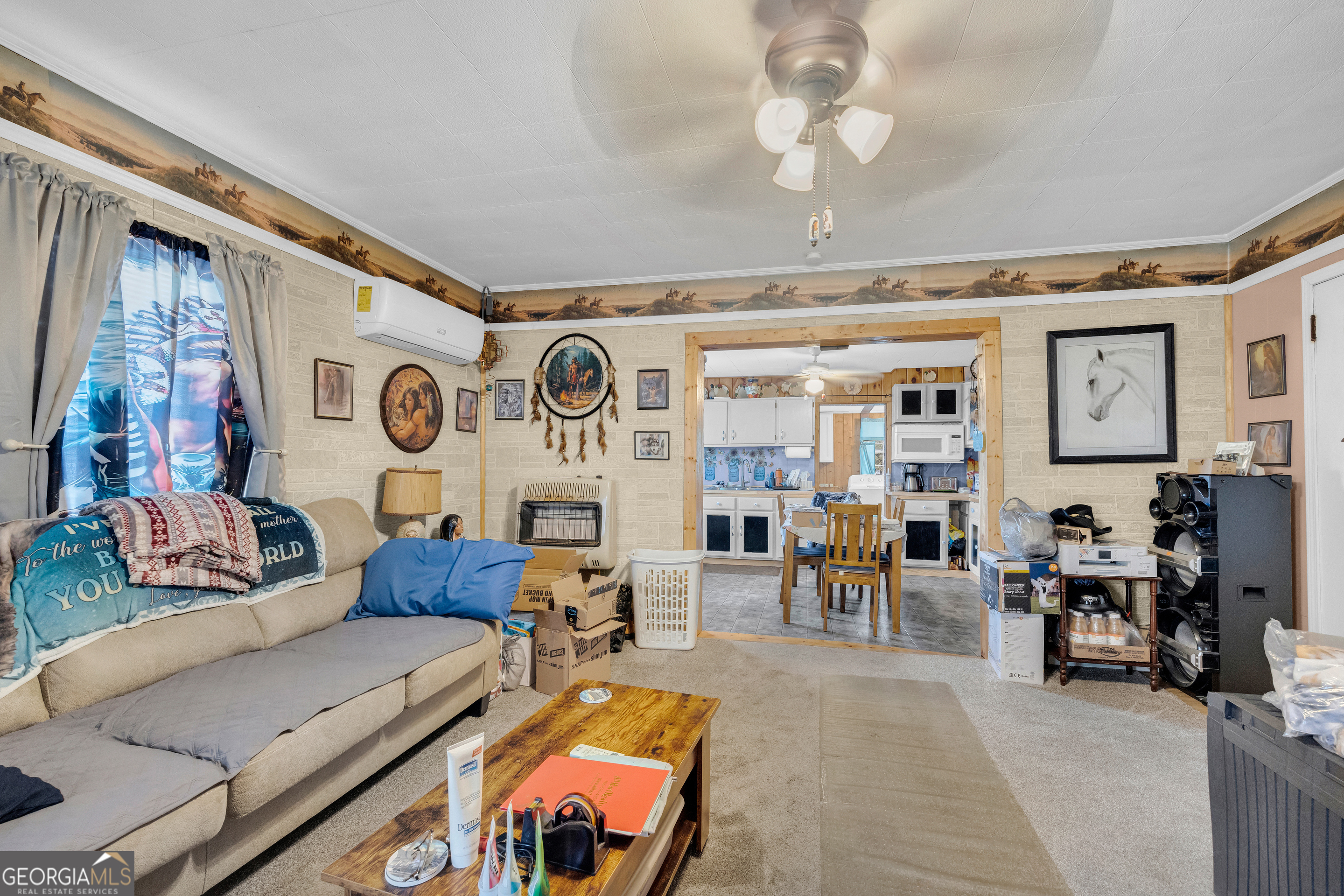 180 Liberty Circle Hartwell, GA 30643 - Photo 40 of 58 a living room with furniture and a large window