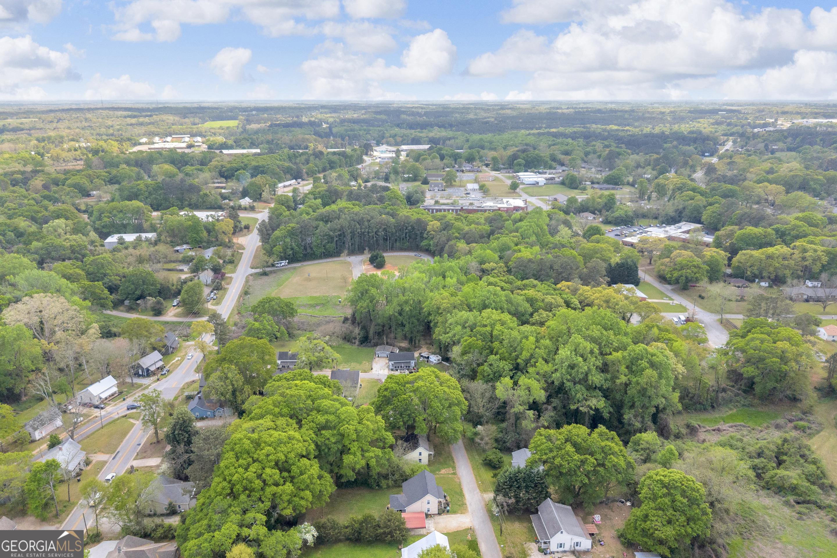 180 Liberty Circle Hartwell, GA 30643 - Photo 5 of 58 an aerial view of residential houses with outdoor space and trees