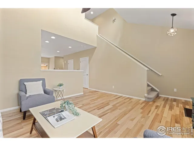 a living room with a couch and chairs