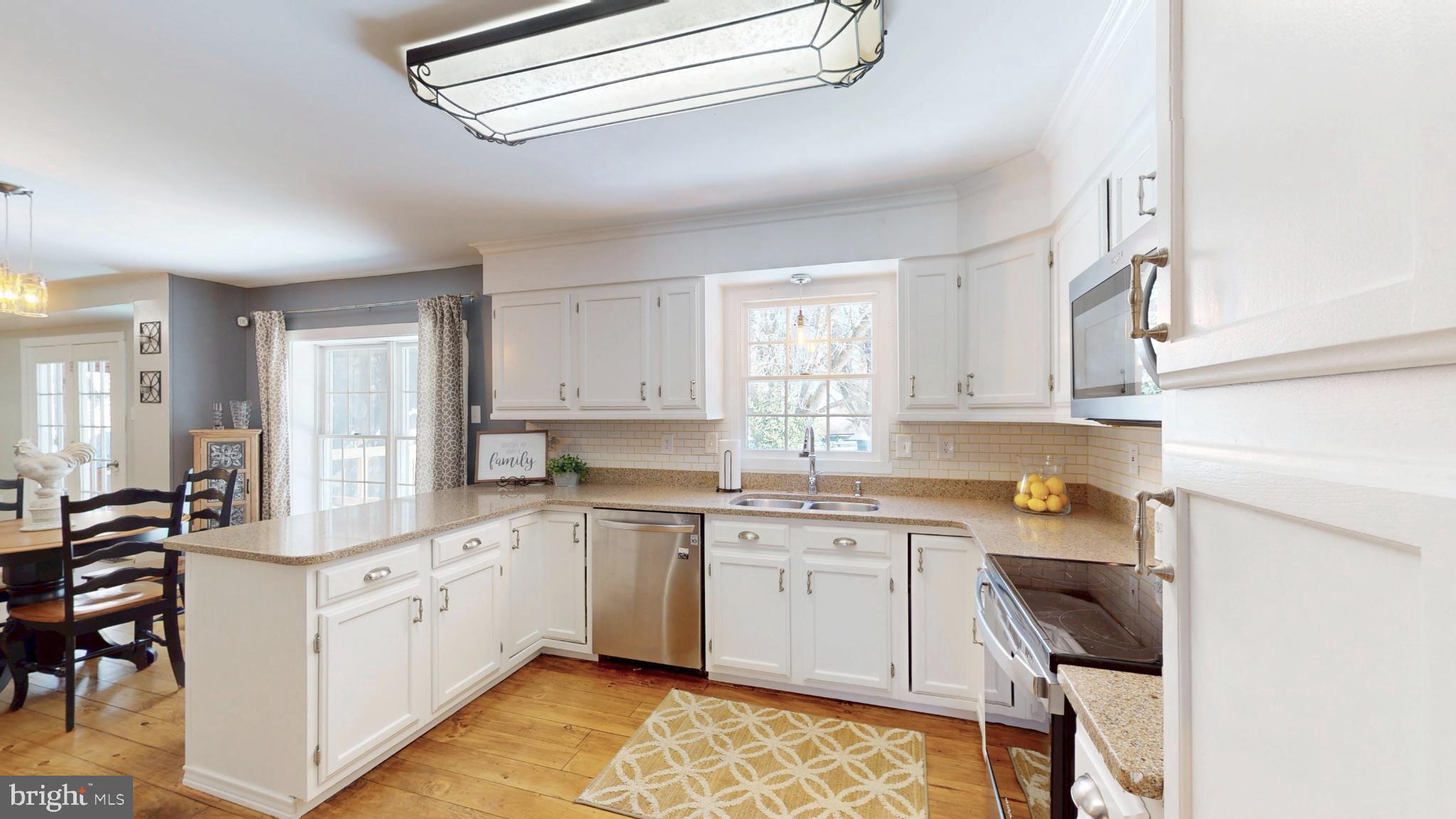 20192 Cockerill Road Purcellville, VA 20132 - Photo 11 of 59 a kitchen with a sink cabinets and window