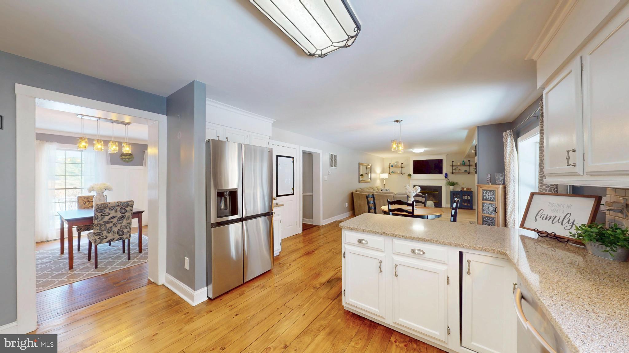 20192 Cockerill Road Purcellville, VA 20132 - Photo 13 of 59 a kitchen with stainless steel appliances granite countertop a refrigerator and a stove top oven