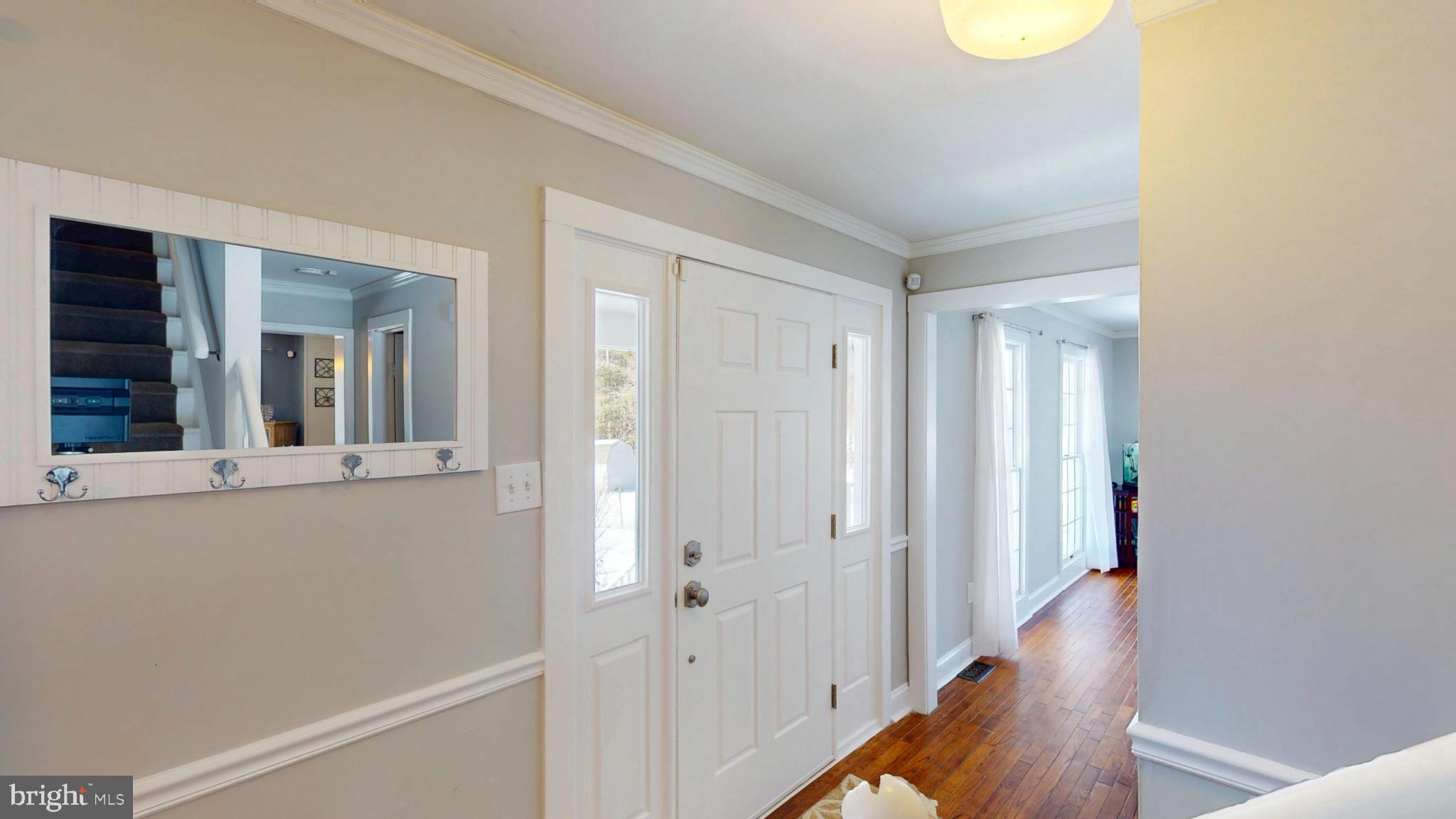 20192 Cockerill Road Purcellville, VA 20132 - Photo 2 of 59 a view of a hallway with wooden floor and staircase