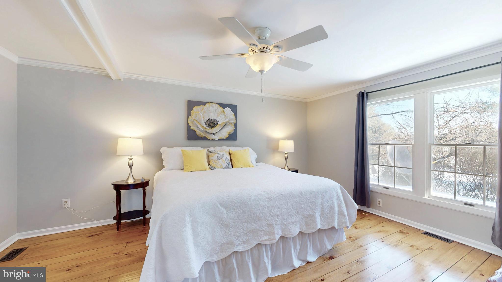 20192 Cockerill Road Purcellville, VA 20132 - Photo 23 of 59 a bedroom with a bed and a chandelier