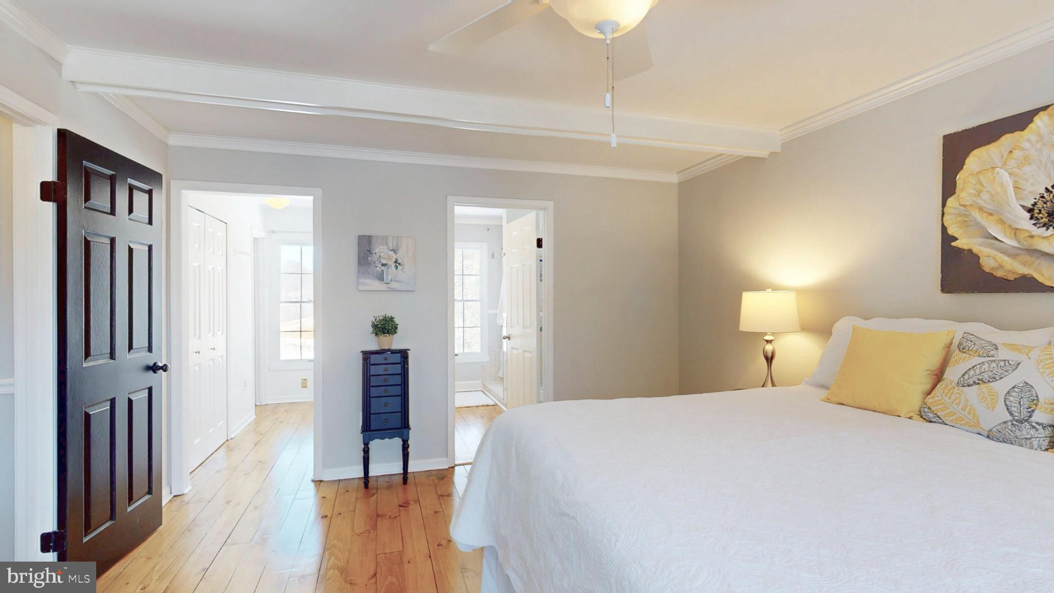 20192 Cockerill Road Purcellville, VA 20132 - Photo 25 of 59 a bedroom with a bed and a mirror