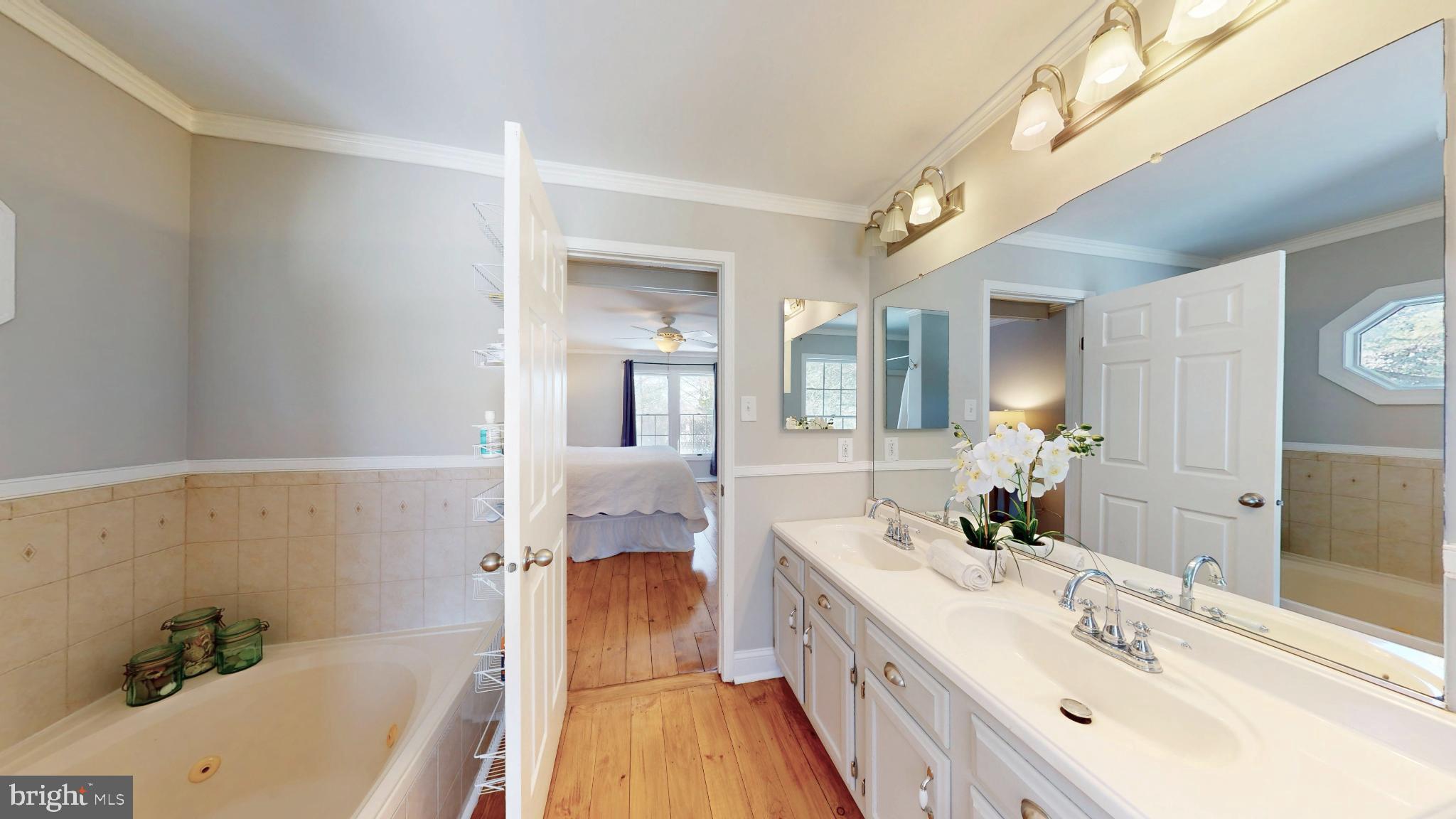 20192 Cockerill Road Purcellville, VA 20132 - Photo 27 of 59 a spacious bathroom with a double vanity sink a mirror and a bathtub