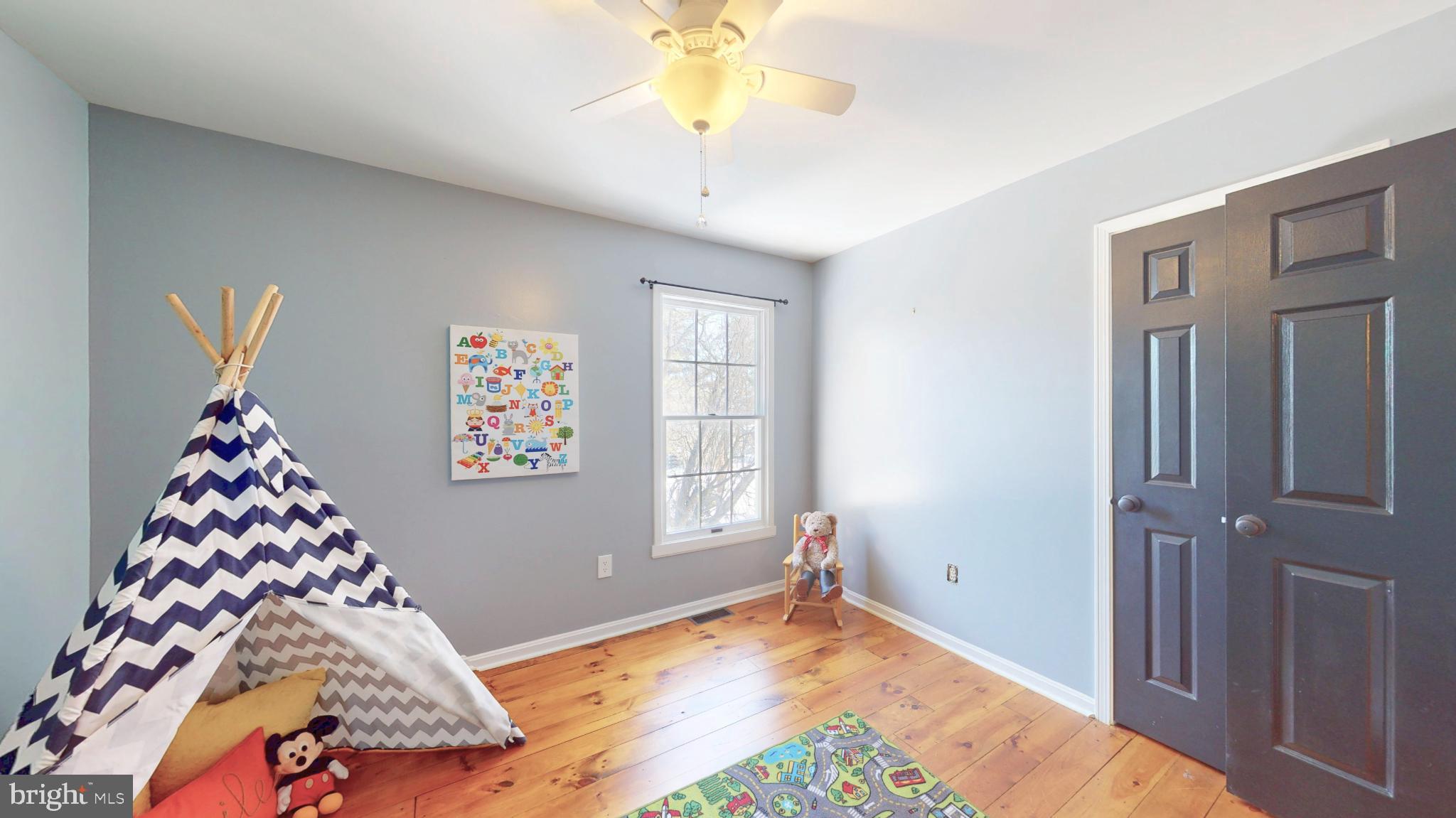 20192 Cockerill Road Purcellville, VA 20132 - Photo 30 of 59 a bedroom with a bed and a window