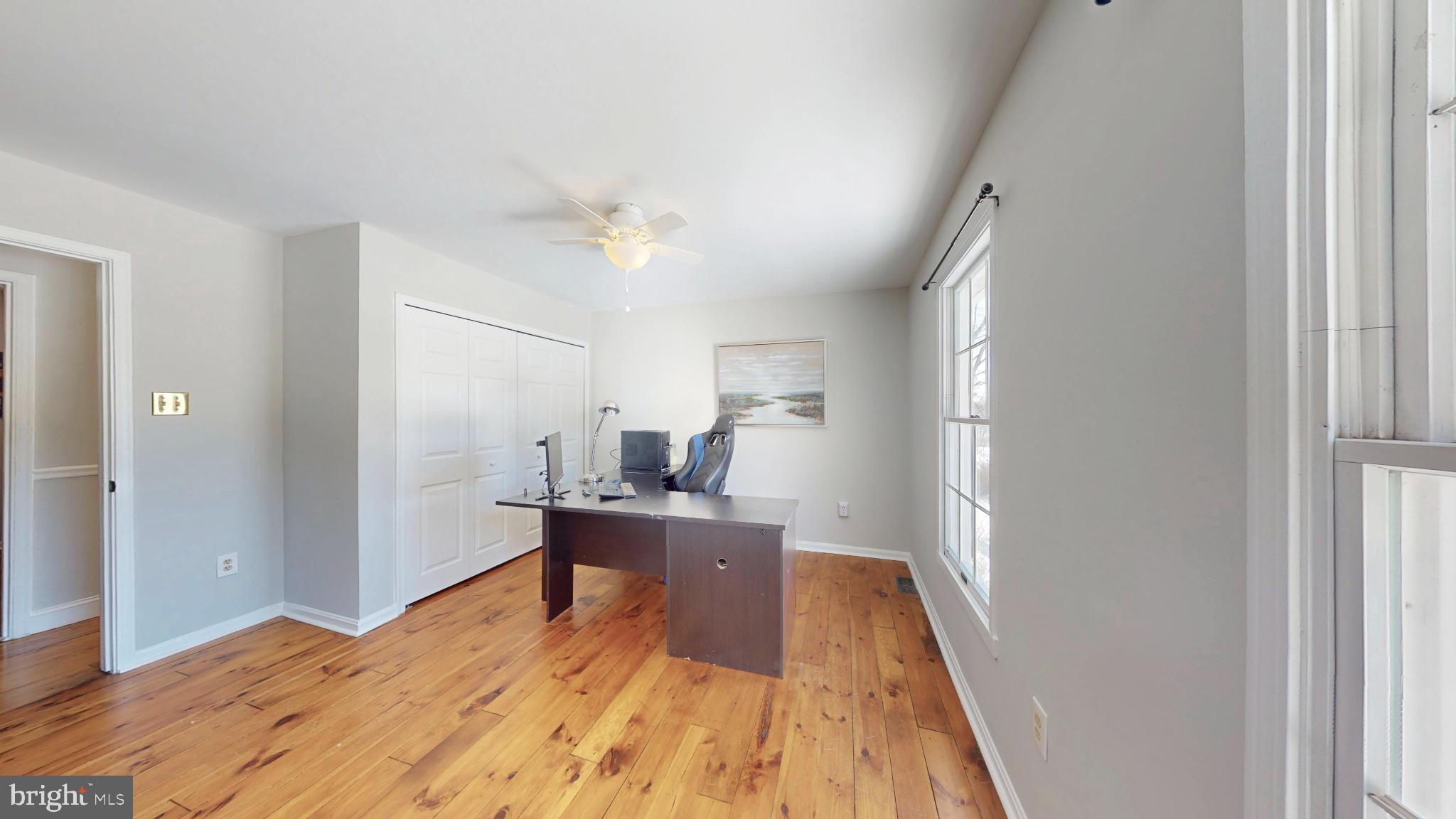 20192 Cockerill Road Purcellville, VA 20132 - Photo 36 of 59 a view of a bedroom with a bed and wooden floor