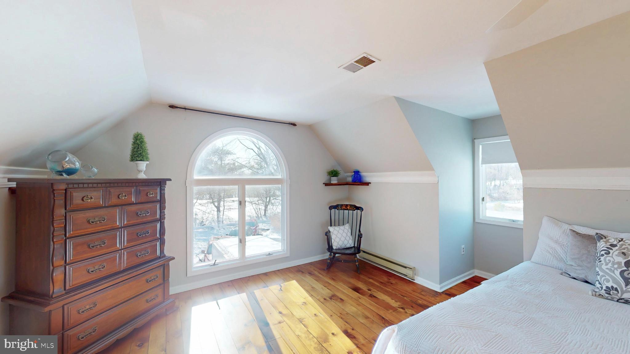 20192 Cockerill Road Purcellville, VA 20132 - Photo 40 of 59 a bedroom with a bed and a large window