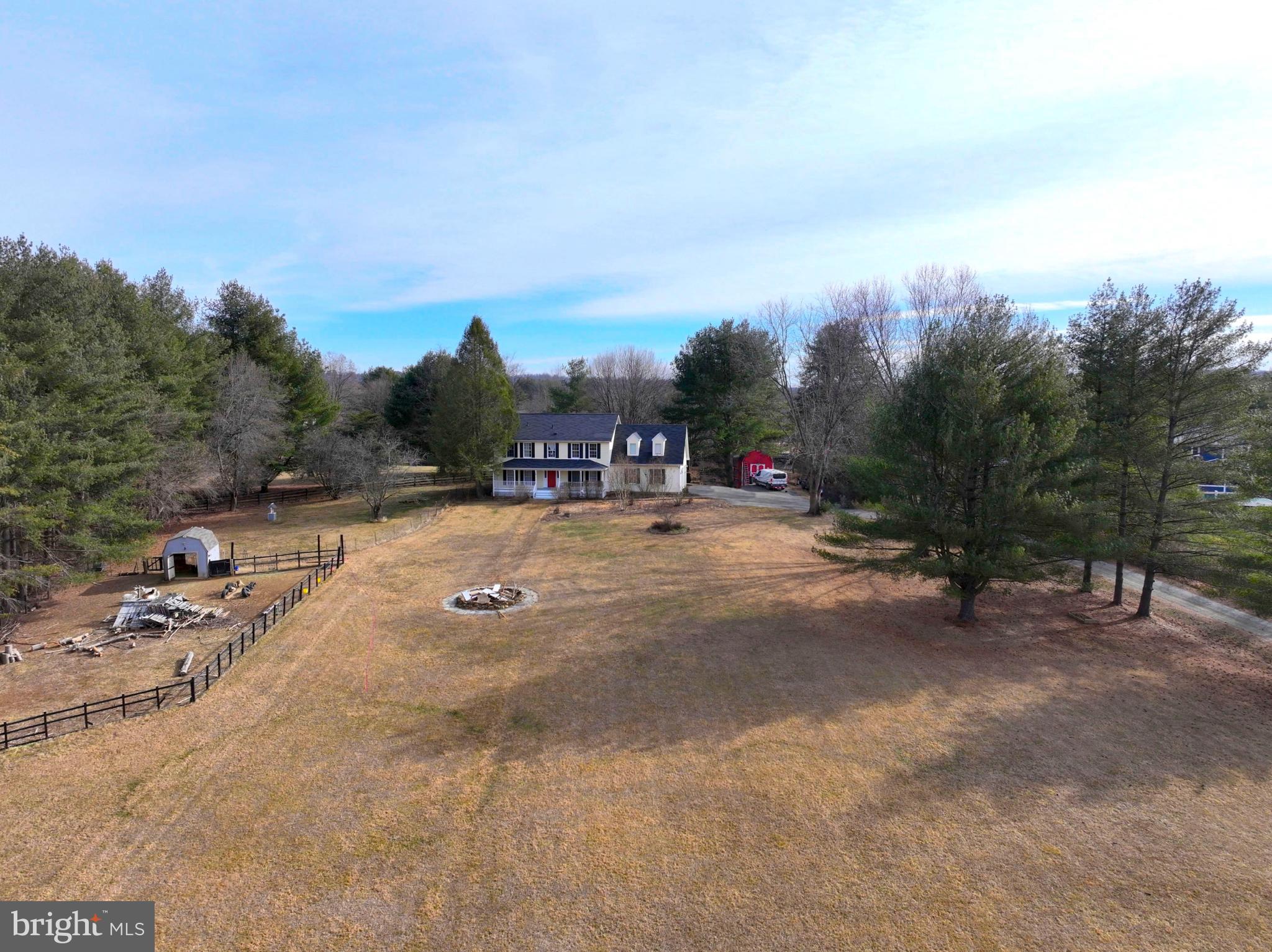 20192 Cockerill Road Purcellville, VA 20132 - Photo 45 of 59 a view of swimming pool with outdoor seating and trees in the background