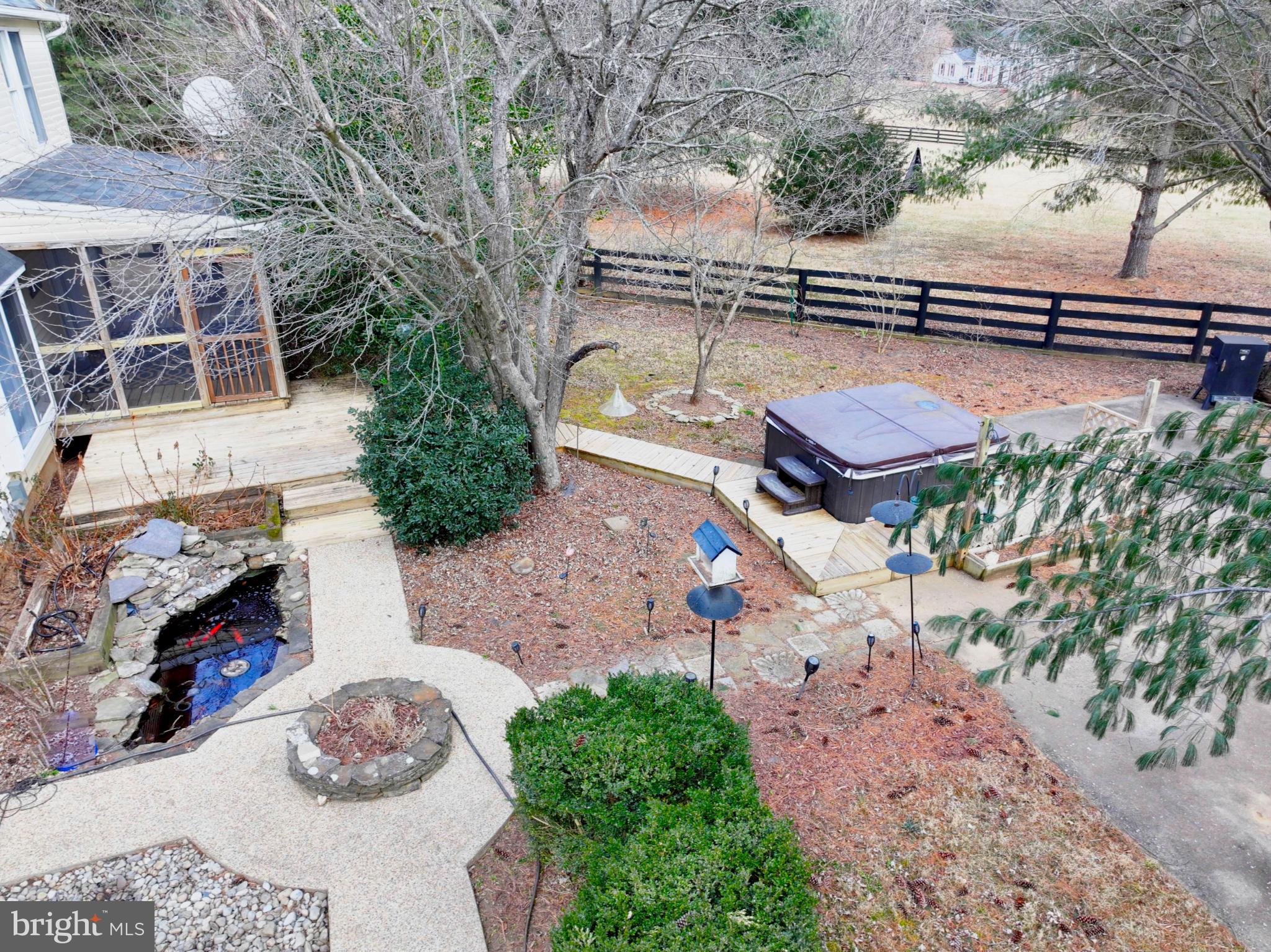 20192 Cockerill Road Purcellville, VA 20132 - Photo 54 of 59 a view of a chairs and fire pit in the backyard