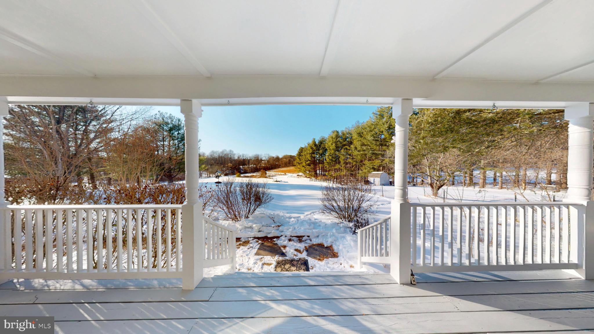 20192 Cockerill Road Purcellville, VA 20132 - Photo 6 of 59 a view of a porch with chairs and couches