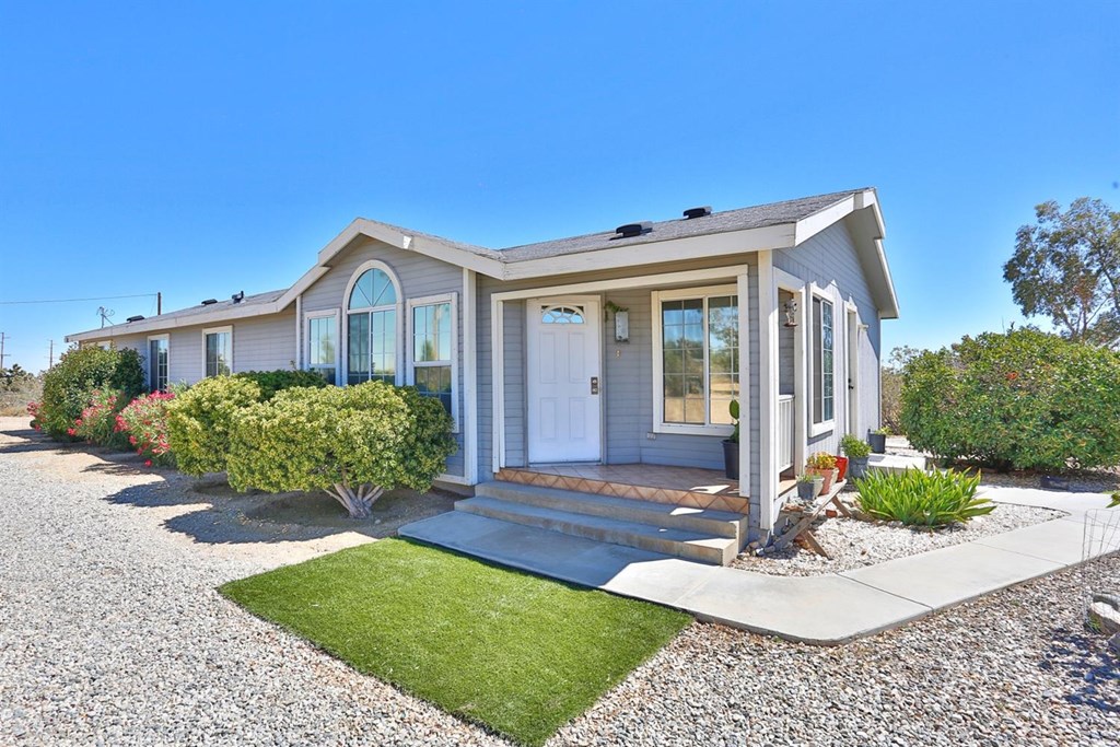 12575 Johnson Road Phelan, CA 92371 - Photo 1 of 1 a front view of a house with a yard