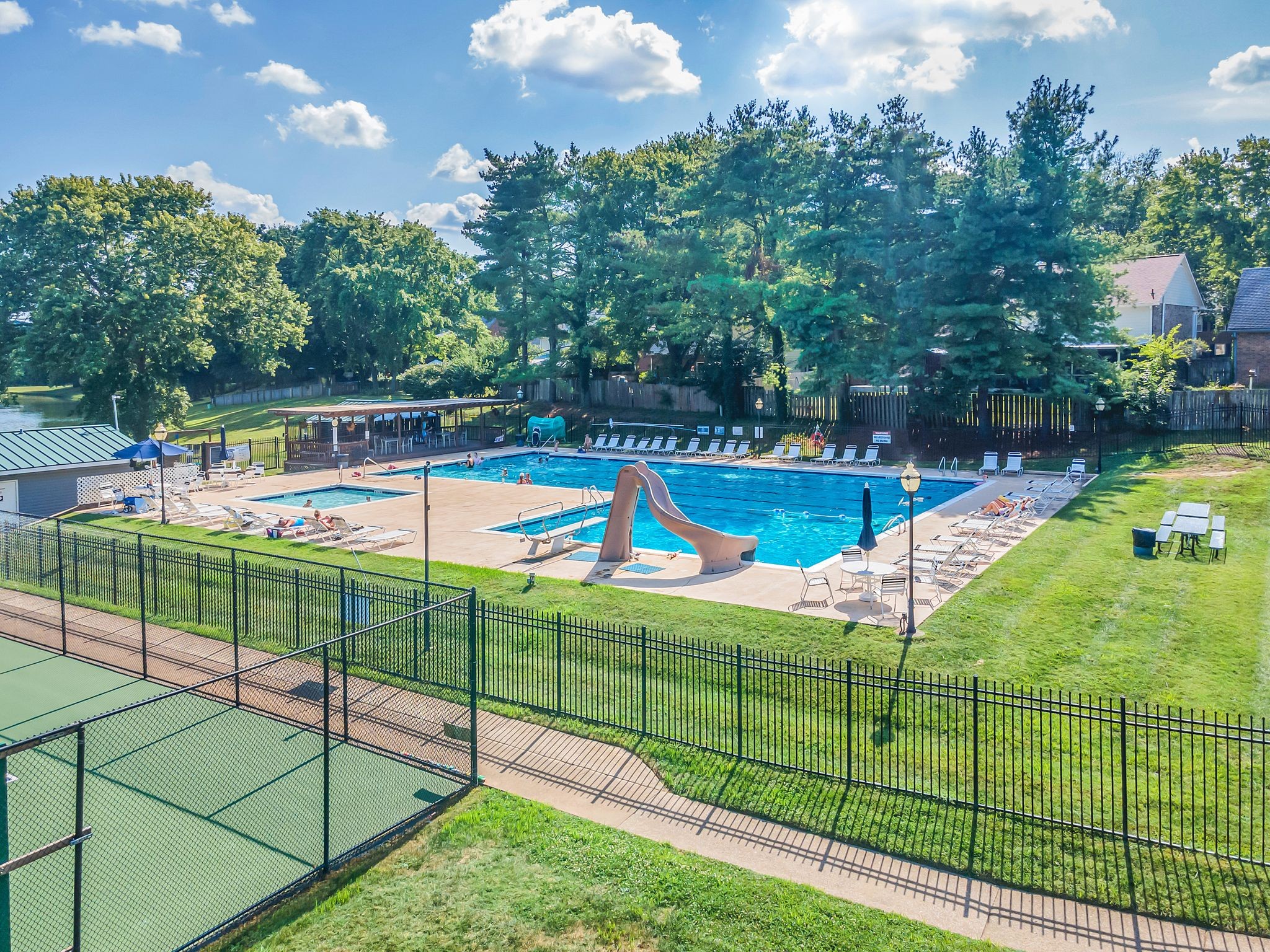 697 Watson Branch Drive Franklin, TN 37064 - Photo 24 of 36 a view of a backyard with swimming pool and sitting area
