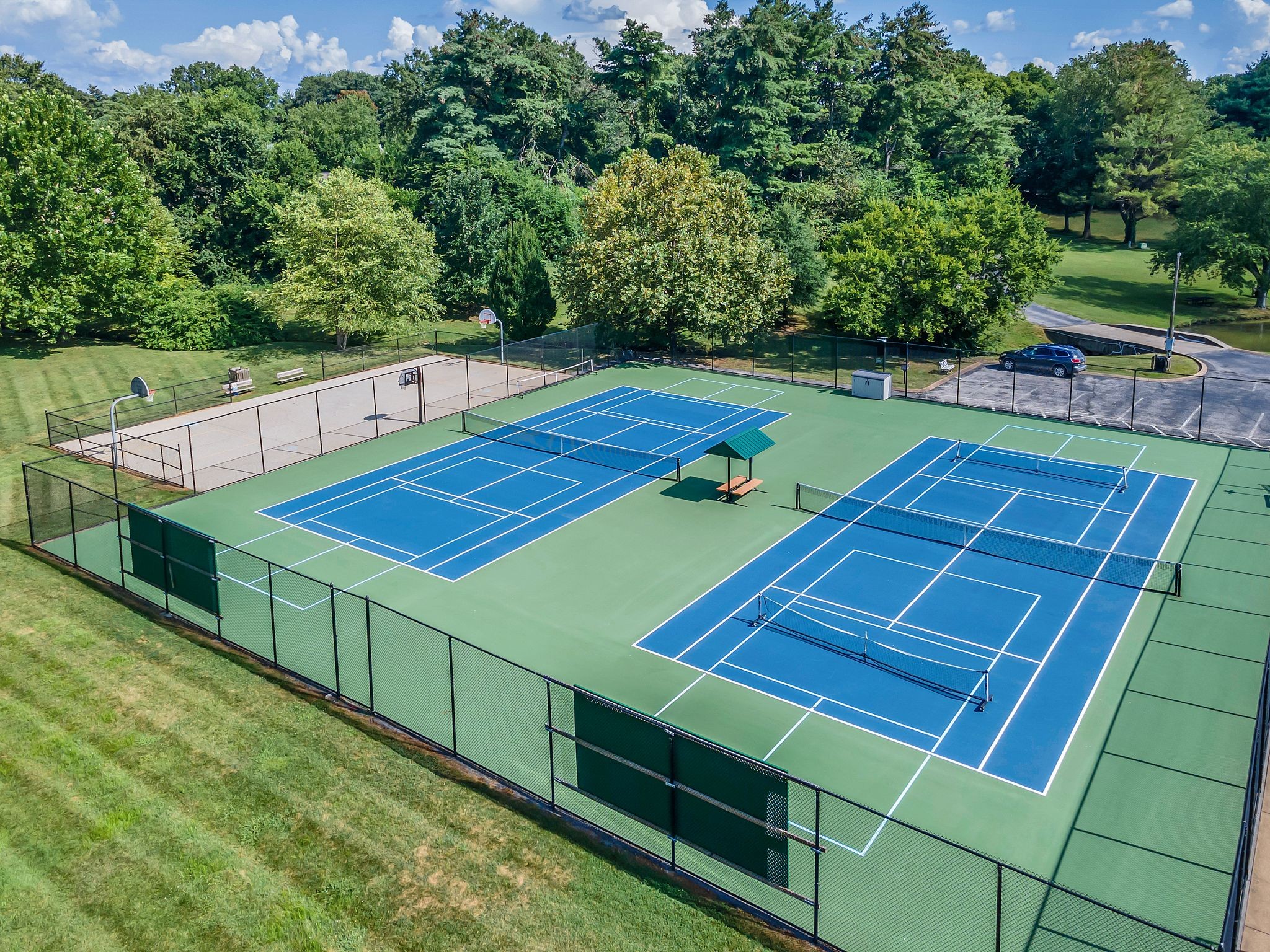 697 Watson Branch Drive Franklin, TN 37064 - Photo 30 of 36 a view of a tennis ground with large trees