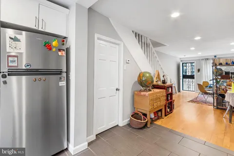 a room with furniture and gym equipment