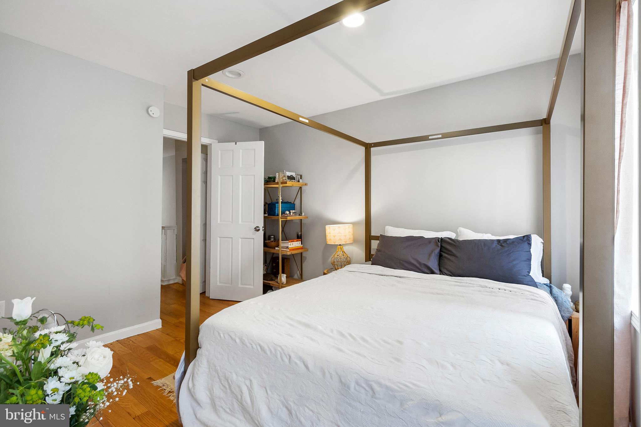 618 McClellan Street Philadelphia, PA 19148 - Photo 25 of 41 a bedroom with a bed and a potted plant