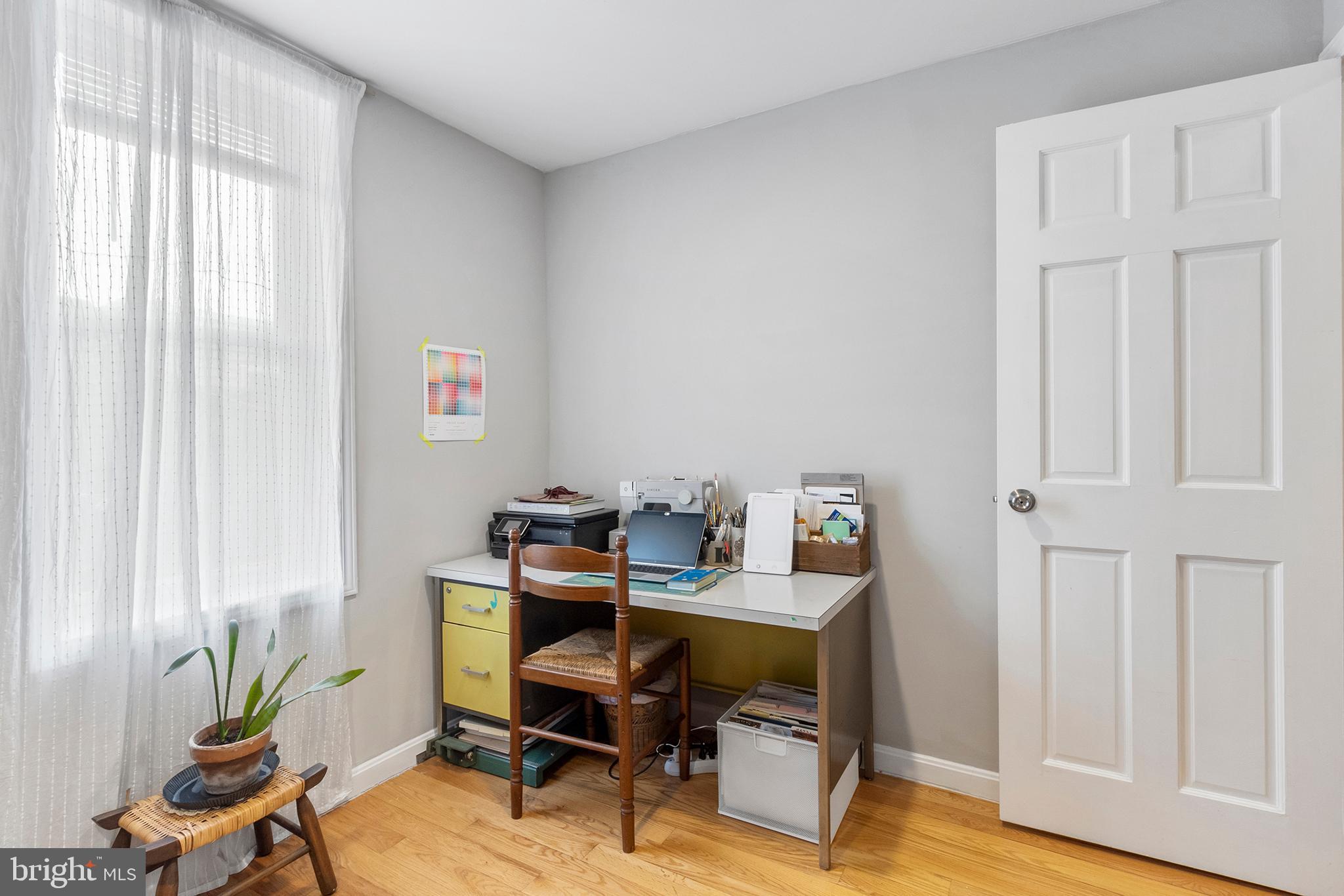 618 McClellan Street Philadelphia, PA 19148 - Photo 30 of 41 a view of a workspace with furniture and a window