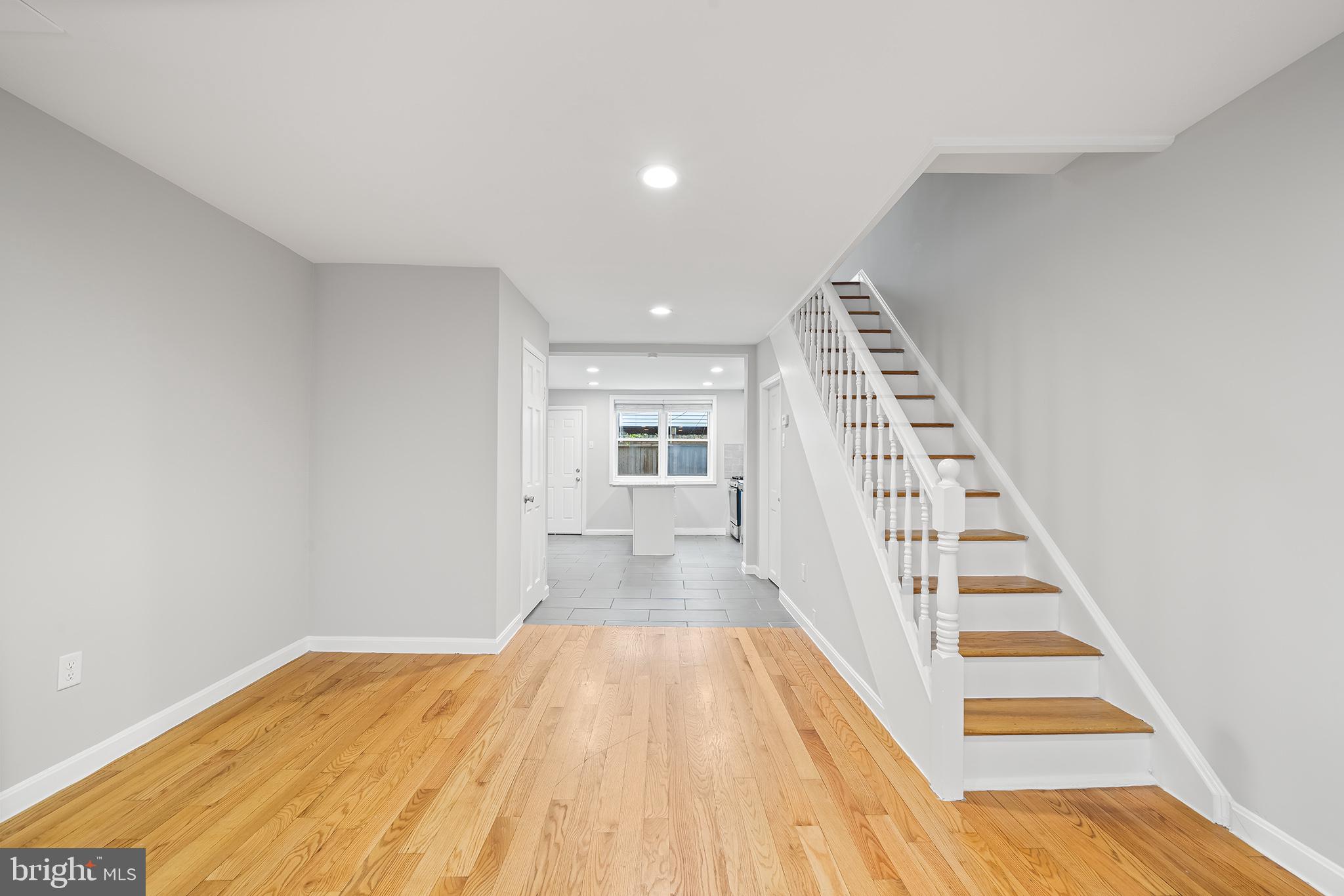 618 McClellan Street Philadelphia, PA 19148 - Photo 4 of 41 a view of a bedroom with wooden floor and stairs