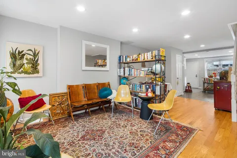 a living room with furniture and a rug