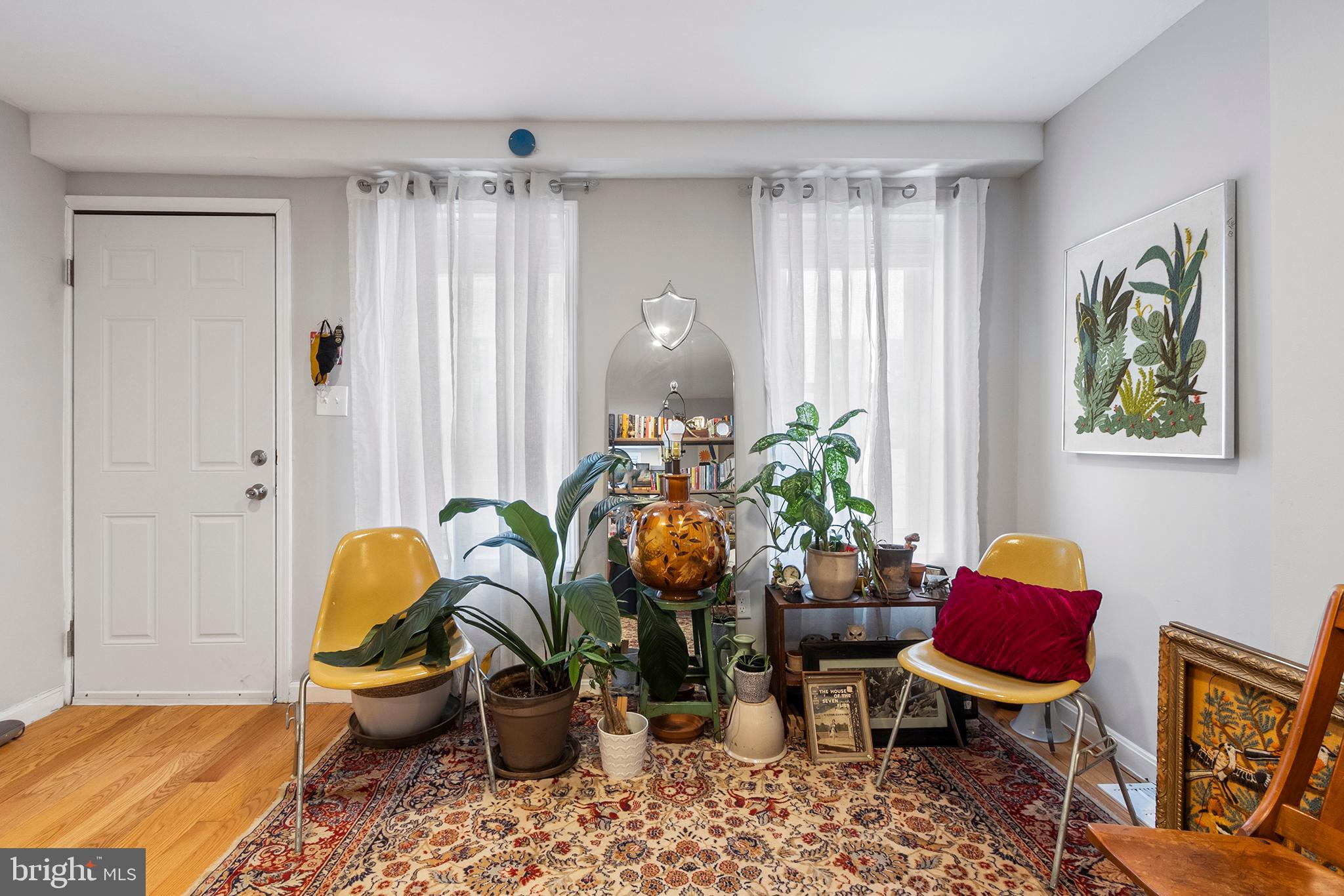 618 McClellan Street Philadelphia, PA 19148 - Photo 9 of 41 a living room filled with furniture and a window