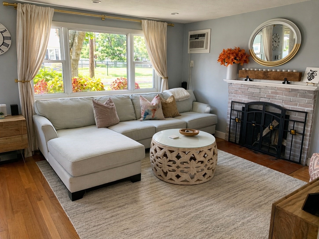 53 Gale Street Waltham, MA 02453 - Photo 5 of 5 a living room with furniture a fireplace and a large window