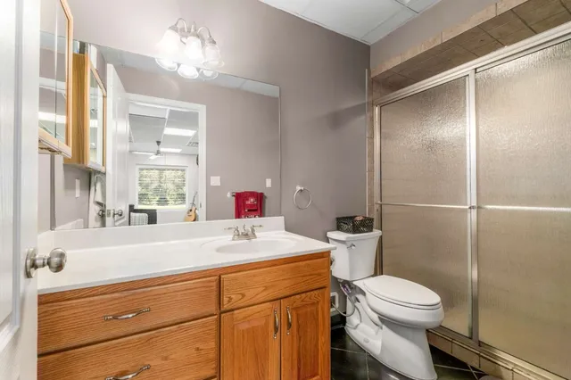 a kitchen with stainless steel appliances granite countertop a sink a stove and a dining table