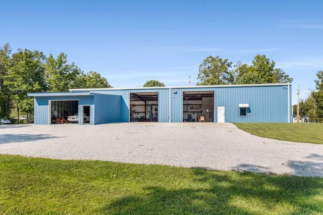 a house with swimming pool in front of it