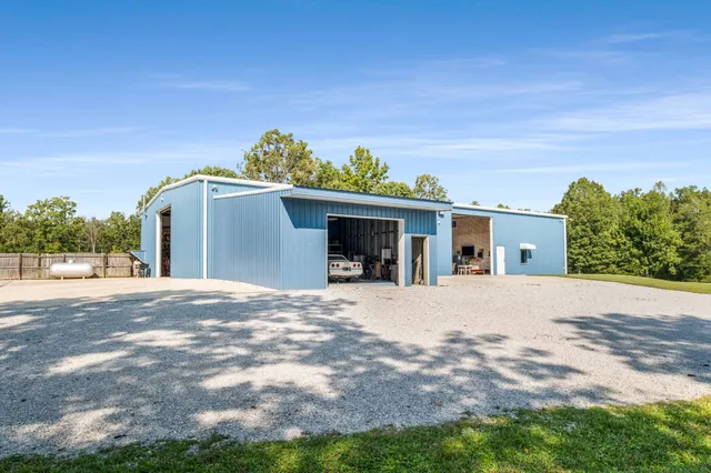 a view of a swimming pool with a yard
