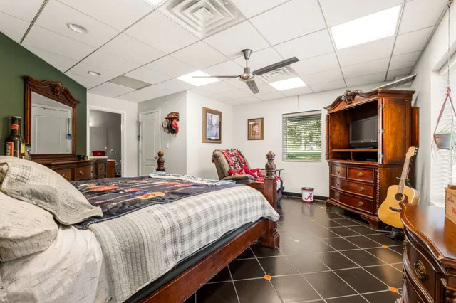 a kitchen with stainless steel appliances kitchen island granite countertop a sink and a refrigerator