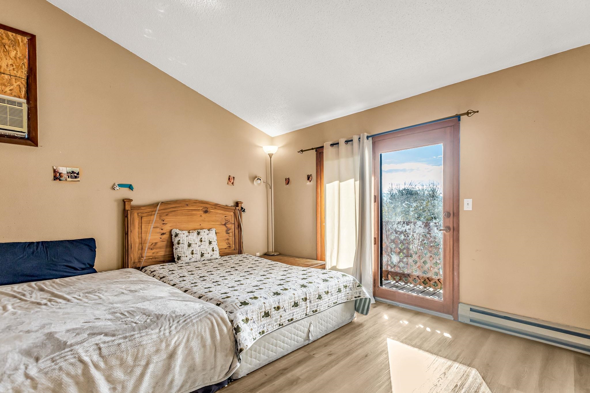 759 Elder Court Rifle, CO 81650 - Photo 11 of 26 a bedroom with a large bed and a window